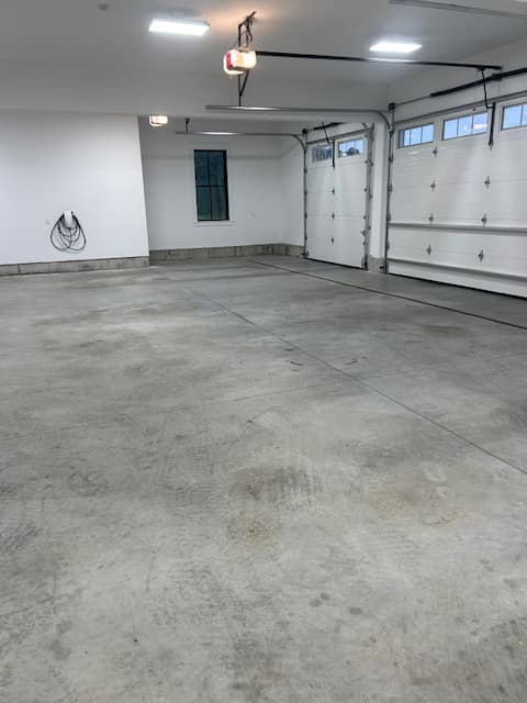 Before Garage Floor Coating - Cracked Concrete with Stains